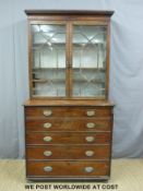 A Georgian mahogany secretaire bookcase, the astragal glazed top with slide out adjustable shelves,