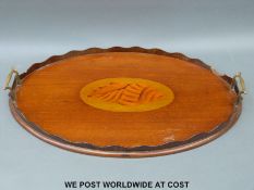 A Victorian mahogany twin handled tray with oval shell inlay (W57cm)