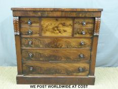 A 19thC flame mahogany chest of seven graduated and one central deep drawer with mother of pearl