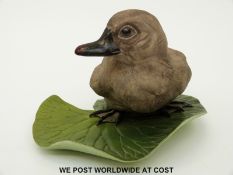 Boehm porcelain study 'Sitting Cygnet on Lily Pad' (9cm tall)