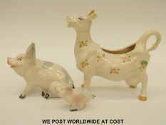 Beswick cow creamer and Beswick pigs