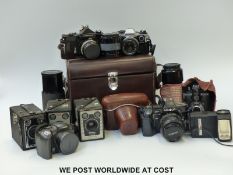 A quantity of cameras including Nikon Nikkomat SLR with Nikkor 1:2 f=50mm lens,