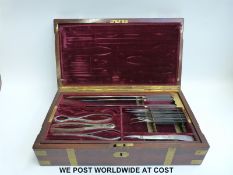 A late 19thC / 20thC surgeon's instrument set in brass-bound mahogany fitted case with lift-out