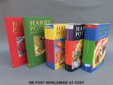 J.K. Rowling a collection of Harry Potter mixing the Collectors' Edition with first trade editions.