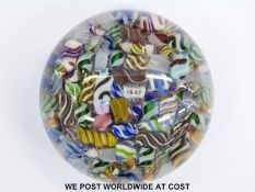 Baccarat or Dupont glass paperweight with multicoloured scrambled latticino tubes and central cane