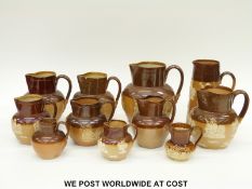 A collection of mainly Doulton Lambeth salt glazed jugs,