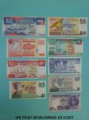 Eight Singapore bank notes including a $50 example, together with a Malaysian $1 note,
