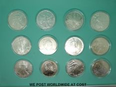 A cased set of 1980-2000 twelve official silver dollars of the United States with certificates