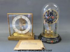 A Jungans retro electric mantel clock together with an anniversary clock