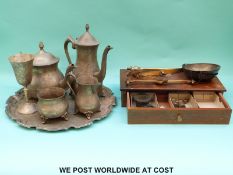 A set of travelling beam scales and assorted weights together with a plated teaset on a tray