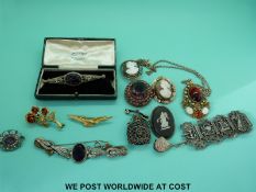 A quantity of costume jewellery to include amethyst brooch, 9ct gold brooch set with a cameo,