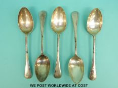 A set of five George V hallmarked silver Old English pattern dessert spoons,