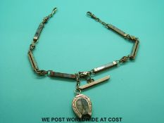 A Victorian rose gold double Albert set with sections of agate with veins of gold running through