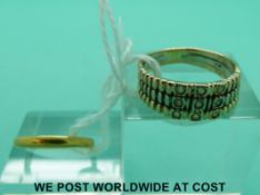 A 22ct gold wedding ring (2.5g, size I) and a tri-coloured yellow metal ring (3.