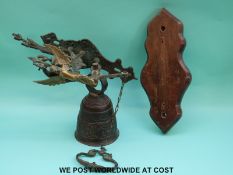 An ornate 19th or 20th century door similar bell with pull chain,