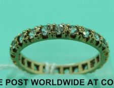 A 9ct gold eternity ring set with paste (2.