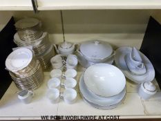 A Limoges dinner and tea service with L C monogram, 12 place setting including dinner plate,