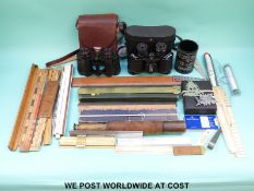 A quantity of rulers including ivory examples, slide rules, binoculars, telescope etc.