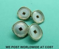 A pair of 9ct gold cufflinks with 18ct gold rims (4.