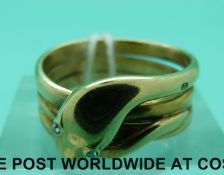 An 18ct gold ring in the form of a snake set with rose cut diamond eyes, London 1893 (8.
