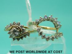 A yellow metal ring marked 14k set with diamonds,