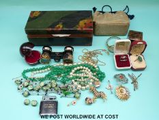 A collection of costume jewellery to include glass beads, silver ring, brooches etc.