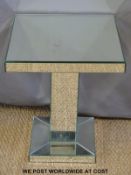 A small square mirror-surfaced table (H54 x W44cm)