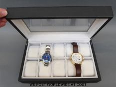 A ten wristwatch display case together with two gentleman's wristwatches,