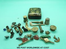 A yellow metal watch key, banded agate charms,