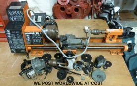 A Minilor TR-1 model engineering/clock making or similar lathe and accessories including