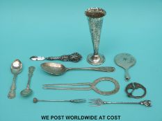 A hallmarked silver spoon of hammered design, two Scottish hallmarked silver forks,