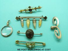 A yellow metal brooch set with pearls, 9ct gold brooch set with garnets and seed pearls,