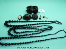 A quantity of jet jewellery to include brooches,