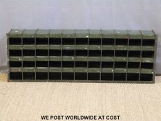 A metal cubby or pigeon hole unit,