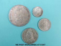 A group of four Victorian jubilee head coins comprising 1890 crown F, 1887 florin and sixpence,