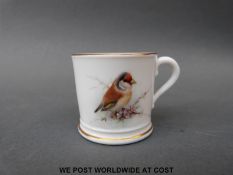 A Royal Worcester goldfinch miniature cup