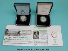 A 1986 XIII Commonwealth Games for Scotland cased silver £2 coin together with a WWII 1995 silver