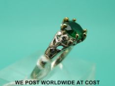 A white metal ring marked 18ct set with a soude doublet and diamonds to the shoulders (size M)