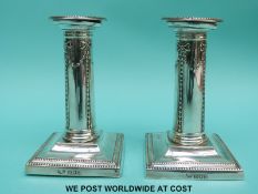 A pair of Edwardian hallmarked silver candlesticks, London 1905 maker Goldsmiths and Silversmiths,