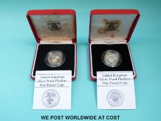 Two cased silver proof Piedfort coins comprising 1985 and 1986 both with certificates