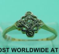 An 18ct gold ring set with diamonds in a platinum setting (size O)