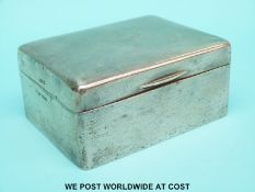 A hallmarked silver cigarette box, Sheffield 1922 maker Walker and Hall,