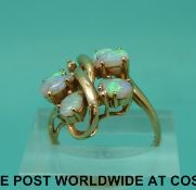 A 14ct gold ring set with six opals and two diamonds (size K)