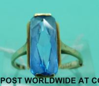 A 14ct gold ring set with a large blue paste (size K)