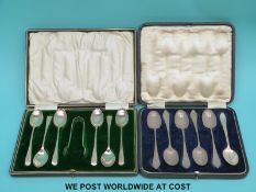 A cased set of six hallmarked silver teaspoons and tongs together with six further hallmarked