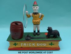 A cast metal 'Trick Dog' novelty moneybox,