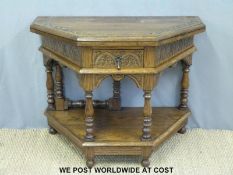 A carved oak fold over octagonal hall table with shelf below (W99 x H79cm)