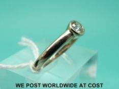 An 18ct white gold ring set with a diamond of approximately 0.