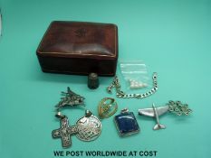 A collection of silver brooches, lapis pendant, silver bracelet,