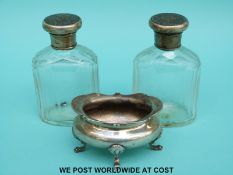 A pair of hallmarked silver topped cut glass dressing table bottles, height 9.